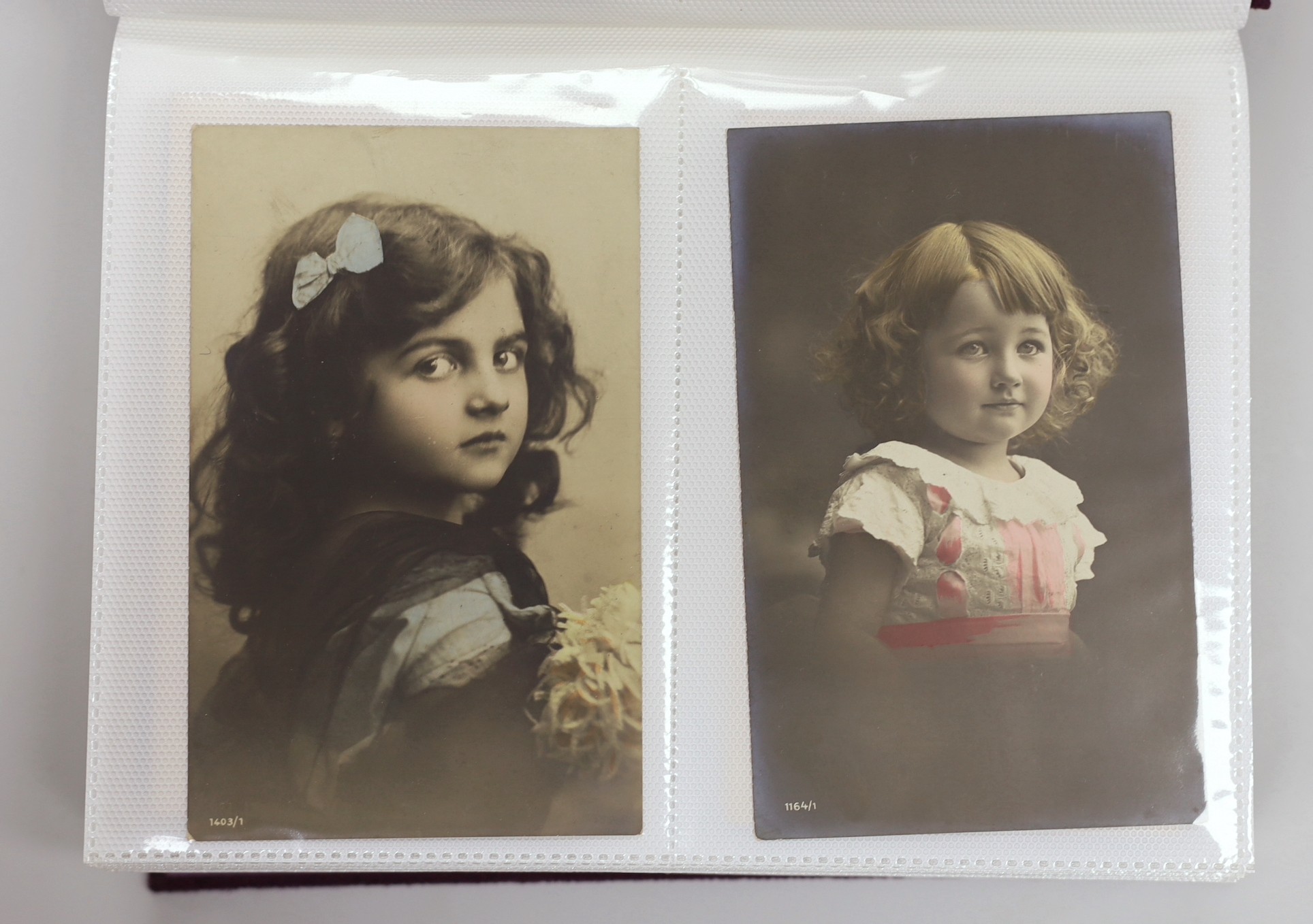 Two postcard albums: early matinee and film stars, topographical scenes and others